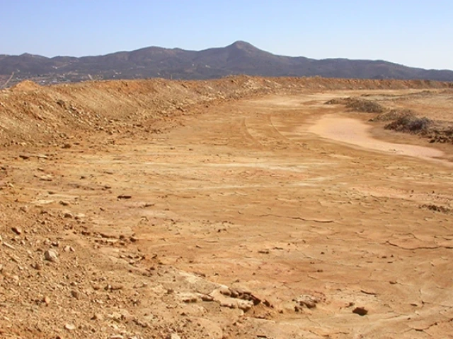 A dry, dusty desert landscape.